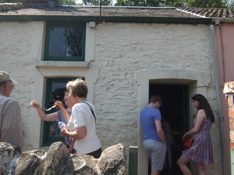 Visitors outside the 1955 house bring the whole place to life