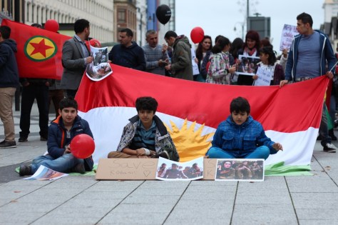 Kurdish families demonstrating in queen street seeking help from Uk government to prevent the genocide of their people fighting against ISIS