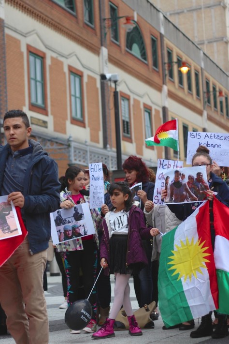 Kurdish families demonstrating in queen street seeking help from Uk government to prevent the genocide of their people fighting against ISIS