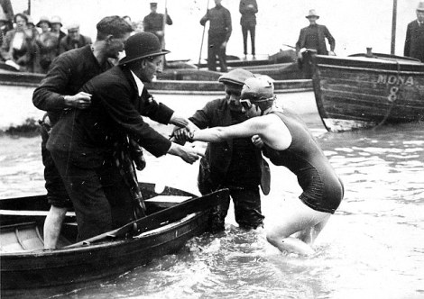 Kathleen Thomas Penarth swimmer climbing into a boat